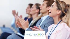 An audience giving a round of applause after a presentation at one of the many Salt Lake City tech conferences.