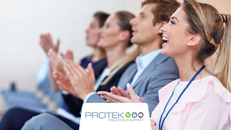 An audience giving a round of applause after a presentation at one of the many Salt Lake City tech conferences.